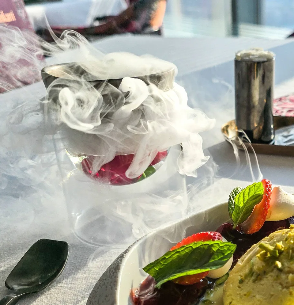 A bowl of ice cream arrives surrounded by a cloud of white vapour.